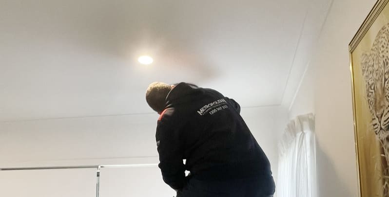 Electrician from Metropolitan Electrical Contractors working on LED lights